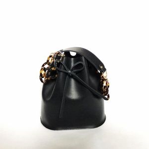 Black leather bucket bag w/tortoise chain (new!)
